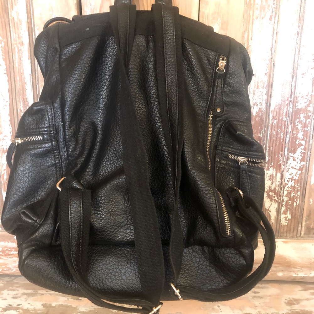 Perfect carryon flight.   Large black tote backpack